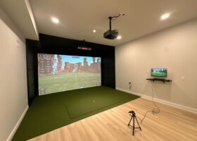 Basement sim featuring Uneekor EYE XO, 16ft D2G dual screen system and custom wall pads – New York Basement sim featuring Uneekor EYE XO, 16ft D2G dual screen system and custom wall pads – New York