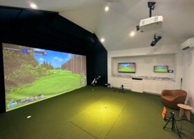 This room features TrackMan with angled ceiling pads, multiple displays and "One-Touch" Automation - New York TrackMan with angled ceiling pads, multiple displays and